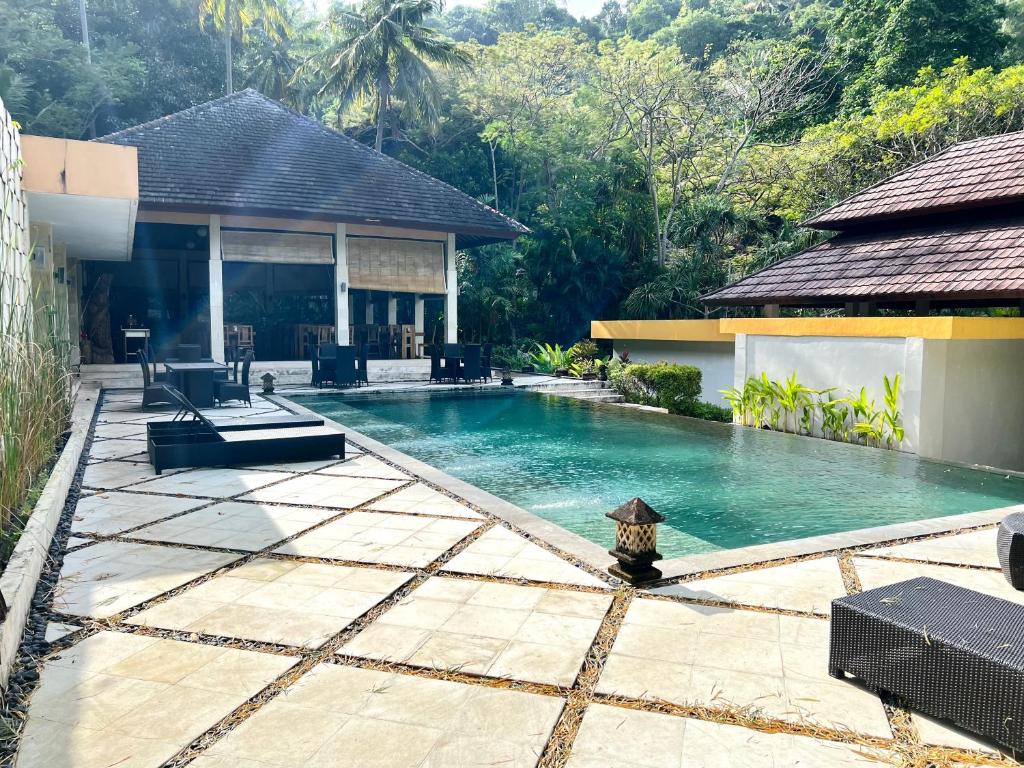 La pileta dentro o cerca de Kebun Villas & Resort