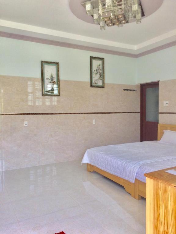 Voodi või voodid majutusasutuse Nhà Nghỉ Nguyên Anh toas