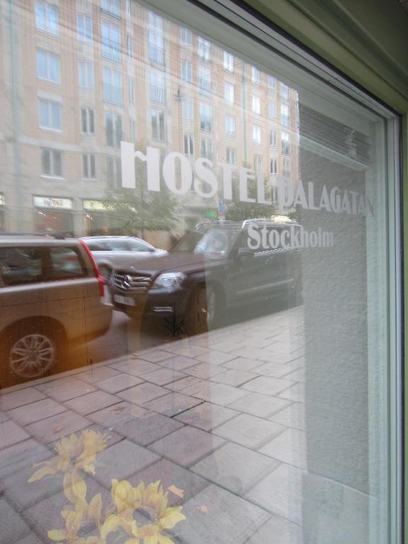 a window of a store with cars in a street at Hostel Dalagatan in Stockholm