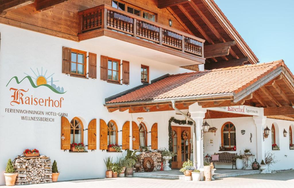 a house with a balcony on top of it at Kaiserhof in Reit im Winkl