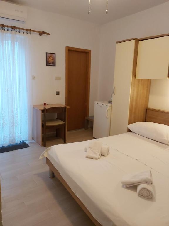 Postel nebo postele na pokoji v ubytování B&B Sobe Magdalena