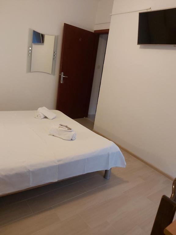 Postel nebo postele na pokoji v ubytování B&B Sobe Magdalena