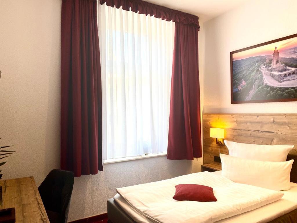 Voodi või voodid majutusasutuse Hotel Friedchen mit eigener Fleischerei toas