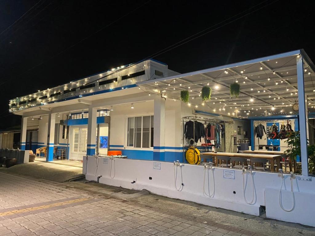 a gas station at night with lights on it at 藍貝島潛水背包旅宿一館 Lambay Island Dive Hostel I in Xiaoliuqiu
