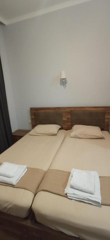 Postel nebo postele na pokoji v ubytování Hotel Posta Khulo