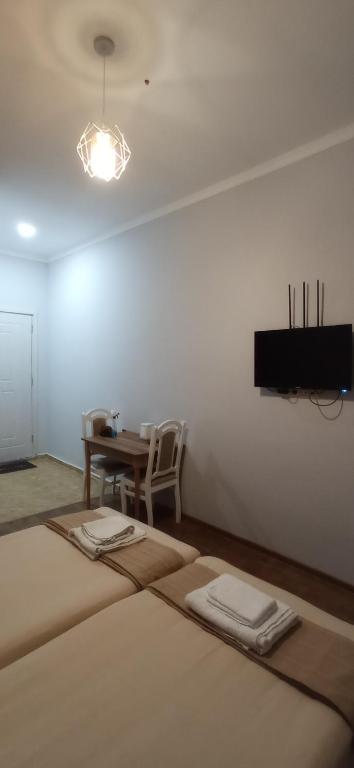 Postel nebo postele na pokoji v ubytování Hotel Posta Khulo