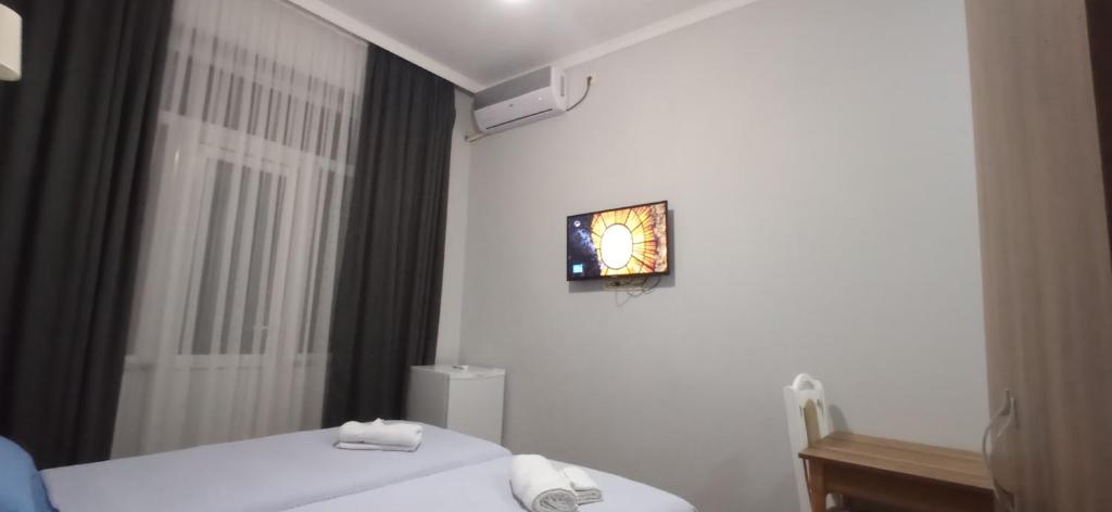 Postel nebo postele na pokoji v ubytování Hotel Posta Khulo
