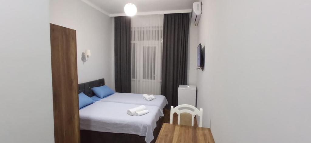 Postel nebo postele na pokoji v ubytování Hotel Posta Khulo