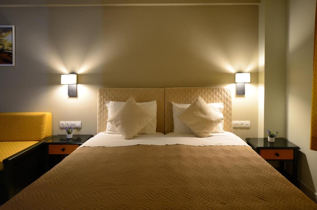 מיטה או מיטות בחדר ב-Maria Beach Hotel