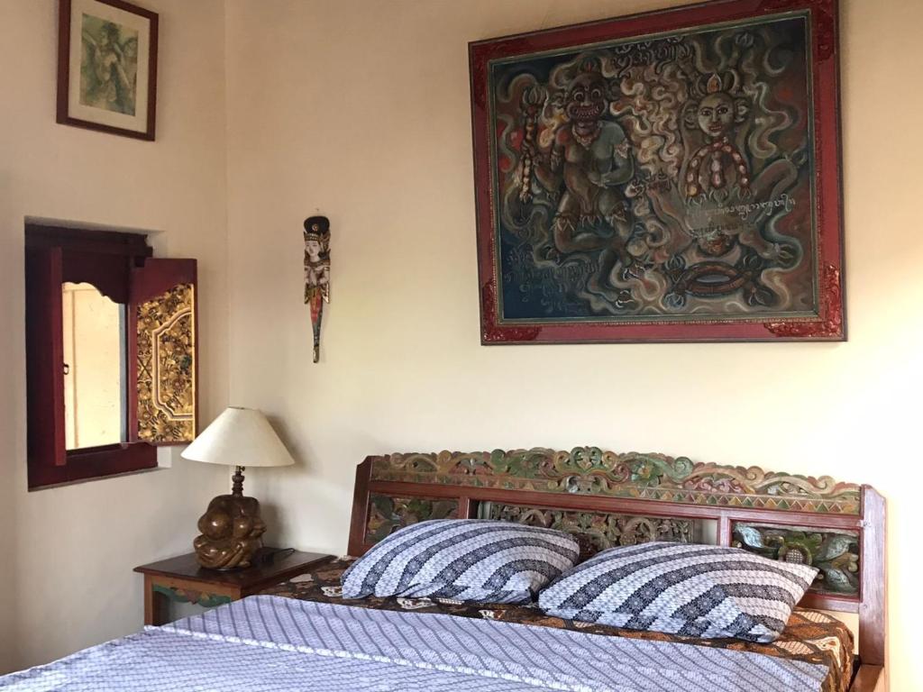 Postel nebo postele na pokoji v ubytování Nirvana Pension