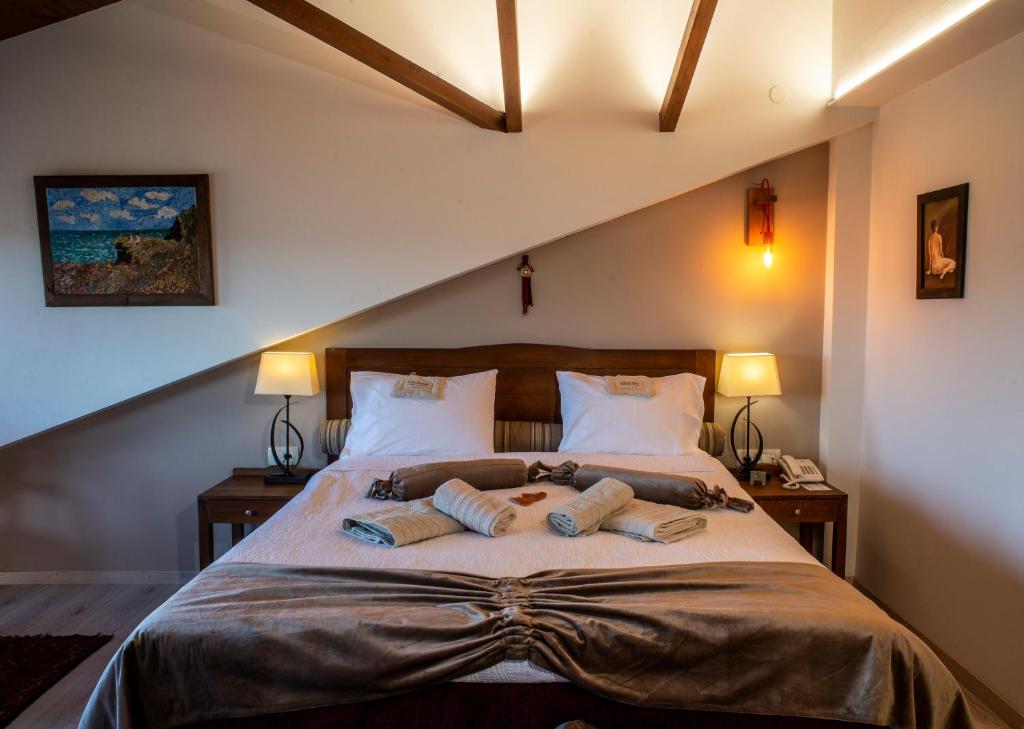 Postel nebo postele na pokoji v ubytování Hotel Rodovoli