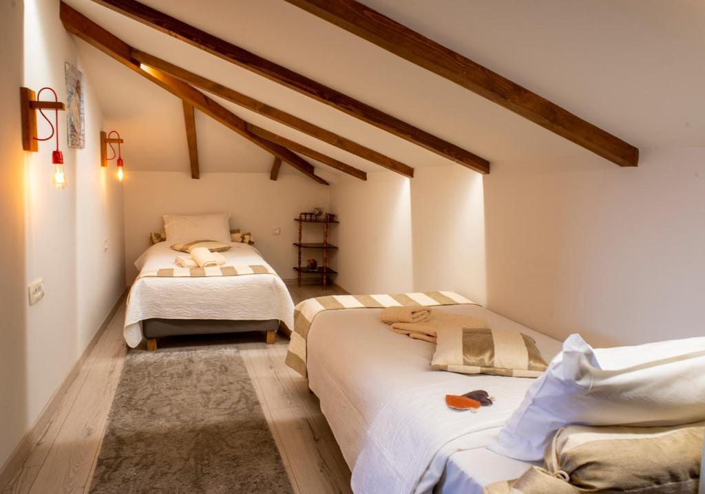 Postel nebo postele na pokoji v ubytování Hotel Rodovoli