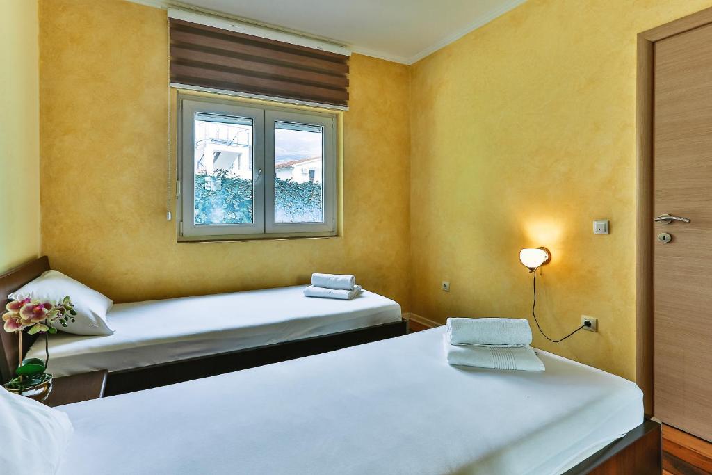 Postel nebo postele na pokoji v ubytování Montesun Holiday Novak Home
