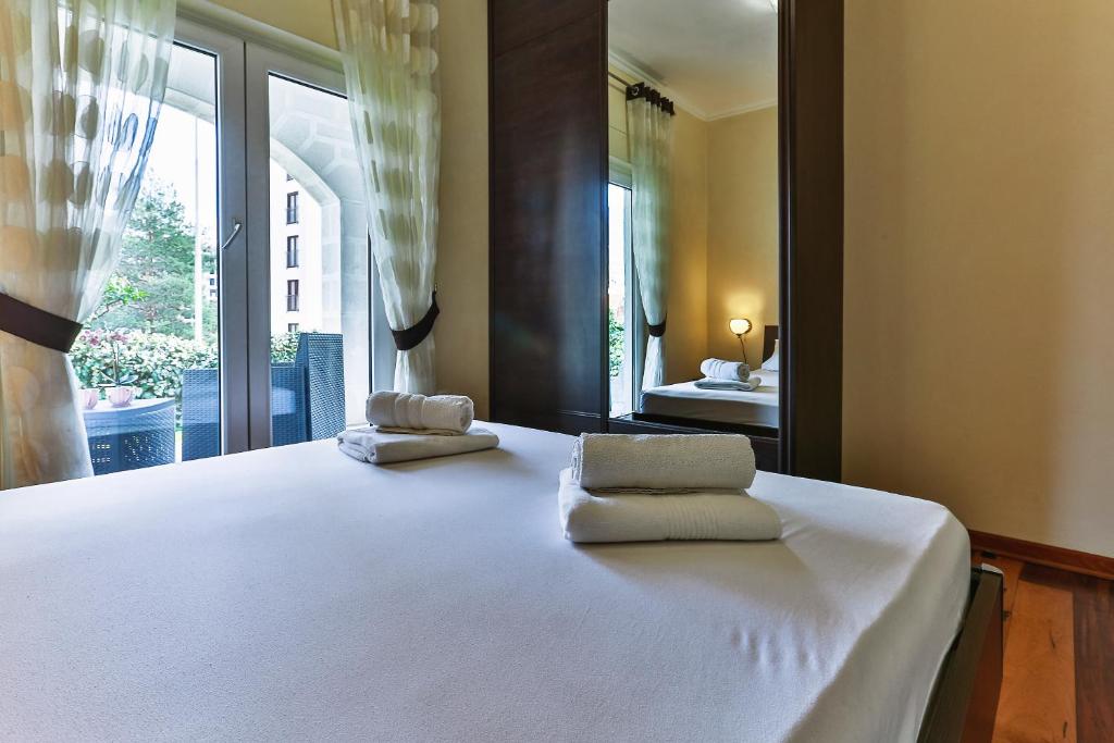 Postel nebo postele na pokoji v ubytování Montesun Holiday Novak Home