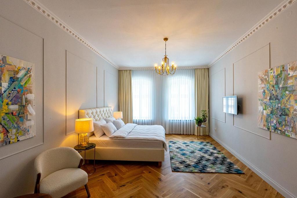 a bedroom with a bed and a window at Casa Zielinski Sighișoara in Sighişoara