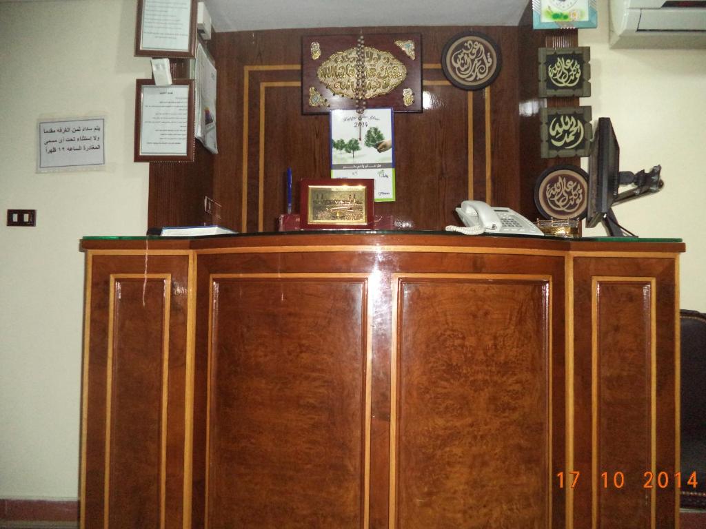a wooden cabinet with a phone on top of it at Al Maghraby Hotel in Alexandria