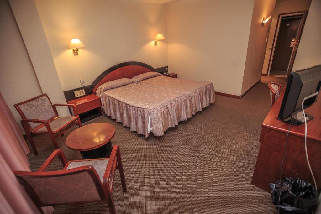 TV a/nebo společenská místnost v ubytování Hotel Roc Del Castell