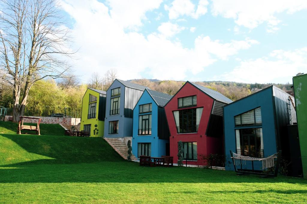 a row of colorful houses on a lawn at Kartepe LOFT in Kartepe