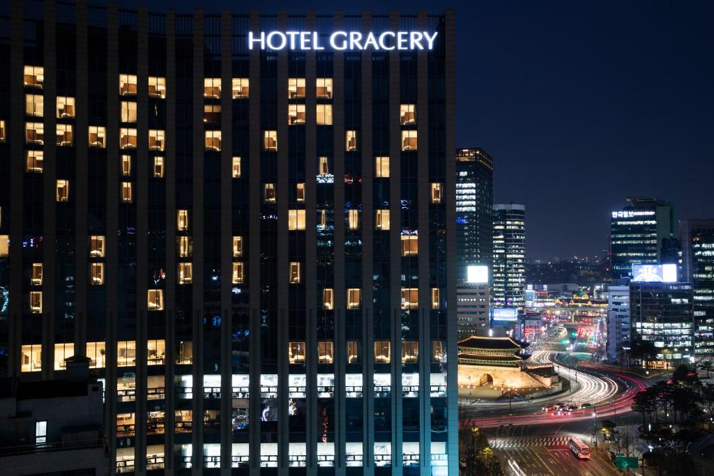 a hotel craigery building in a city at night at Hotel Gracery Seoul in Seoul