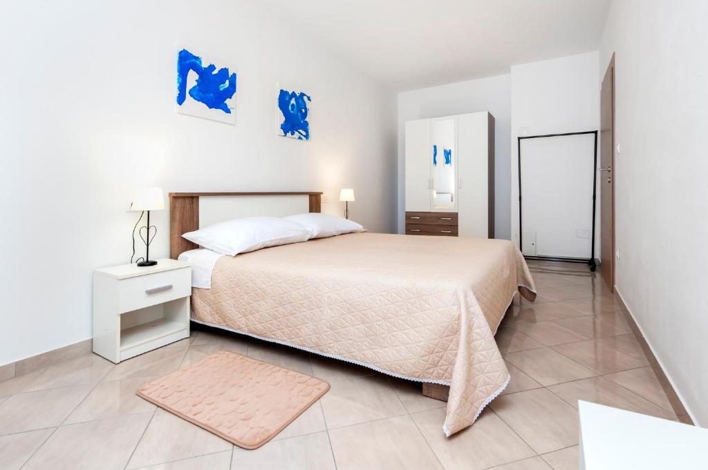 Postel nebo postele na pokoji v ubytování Apartments Vinko
