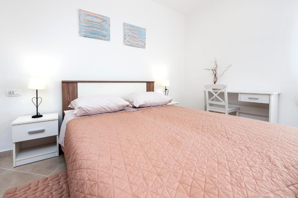 Postel nebo postele na pokoji v ubytování Apartments Vinko