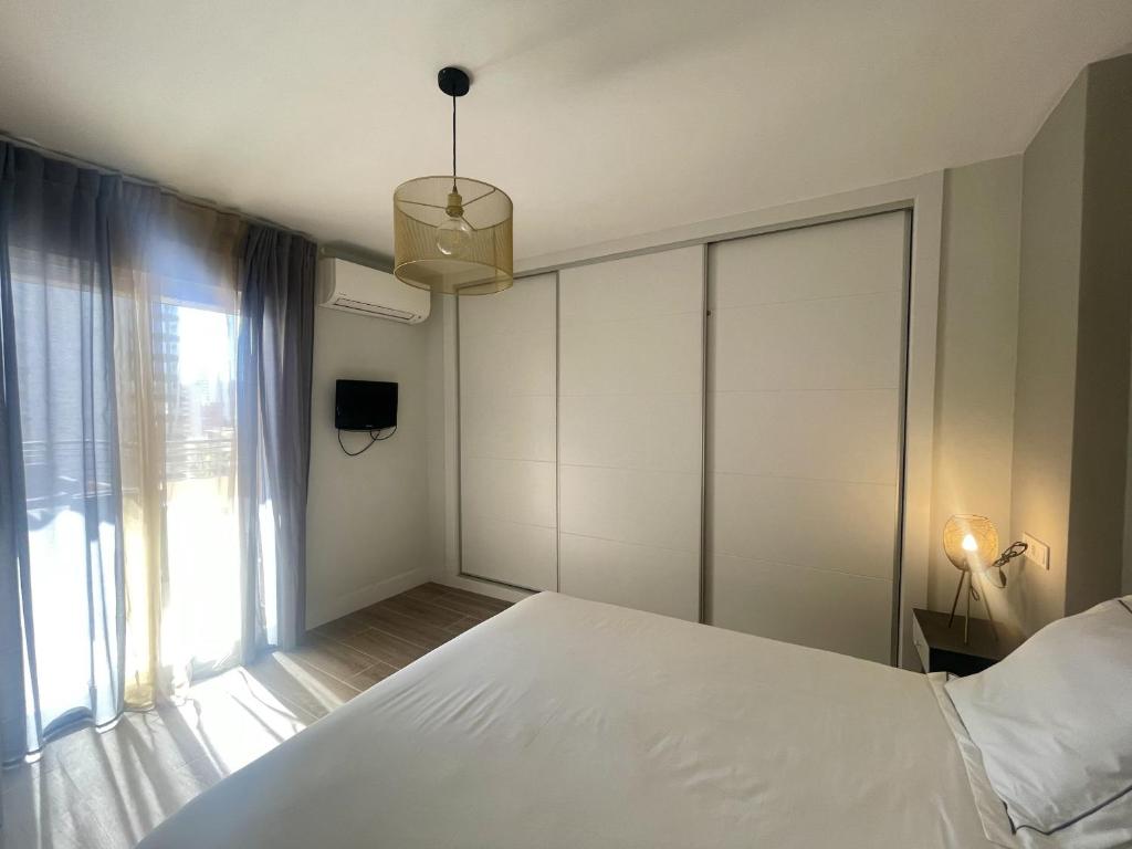 Postel nebo postele na pokoji v ubytování Torre Benidorm Levante
