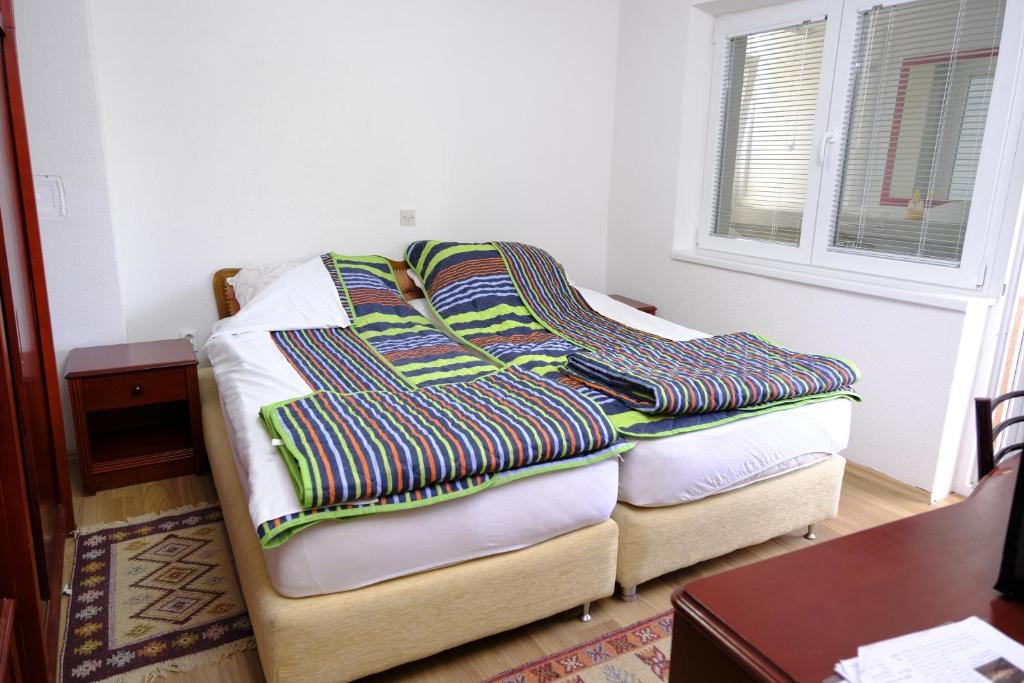 Postel nebo postele na pokoji v ubytování Apartments Surban