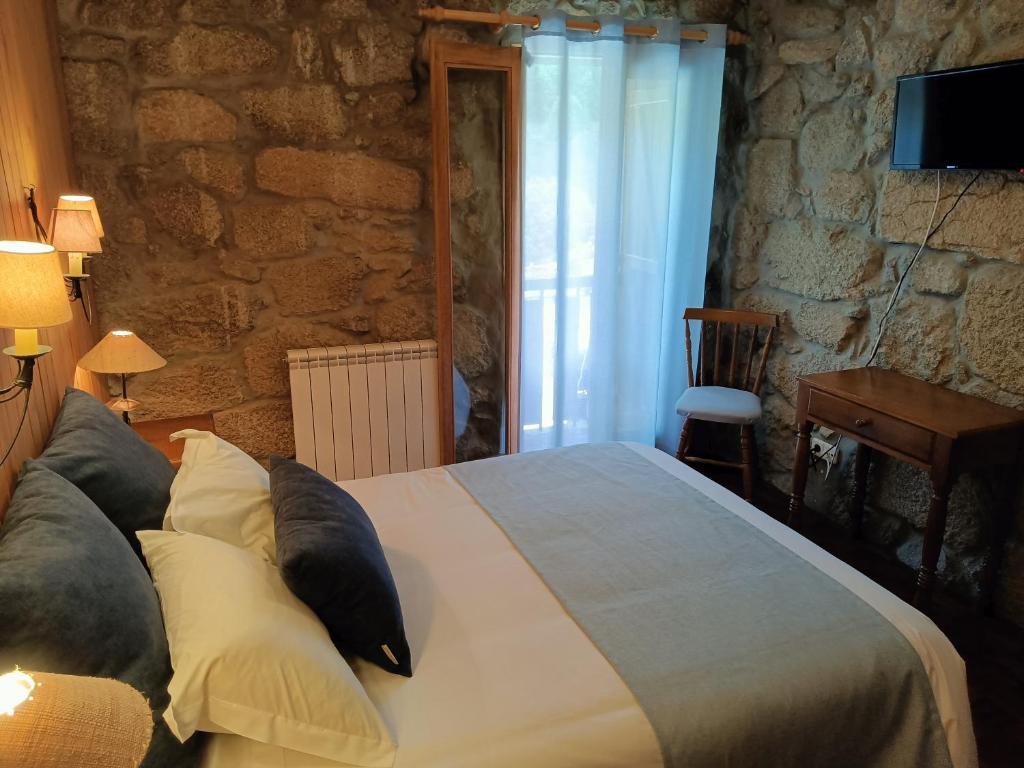 Postel nebo postele na pokoji v ubytování Quinta de Leandres