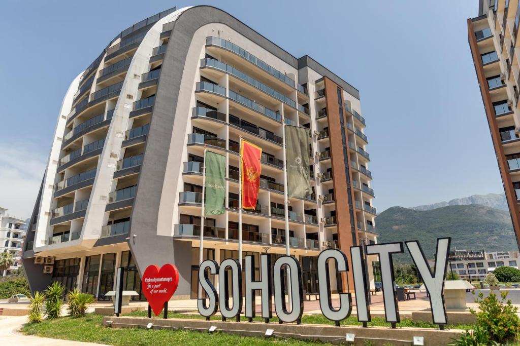 a building with a sign in front of it at Soho city apartment in Bar
