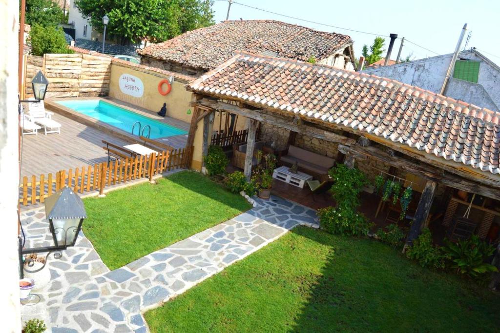 an aerial view of a house with a swimming pool at 6 bedrooms villa with private pool and furnished garden at Campo de Cuellar in Campo de Cuéllar