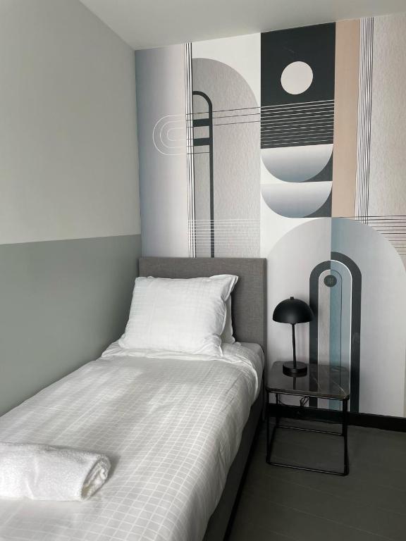 Postel nebo postele na pokoji v ubytování Hotel National Antwerp