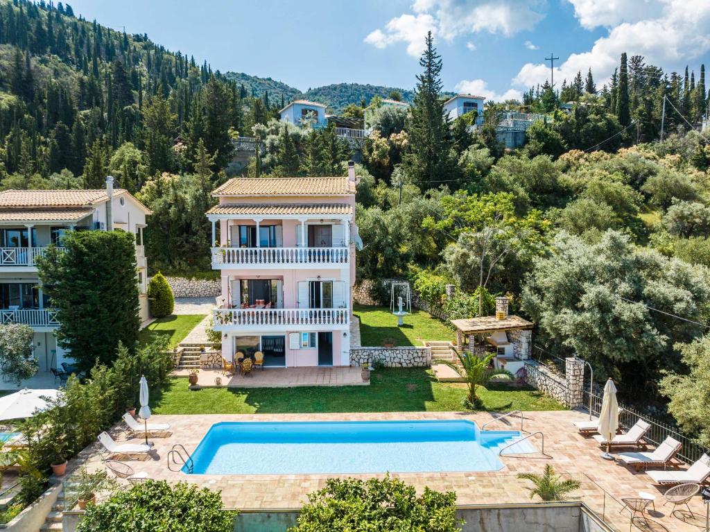 an image of a villa with a swimming pool at VILLA PANOREA in Agios Nikitas