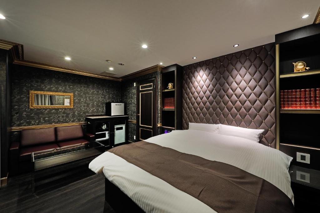 Postel nebo postele na pokoji v ubytování ホテルバースデー岐阜西店 HOTEL Birthday GifuWest