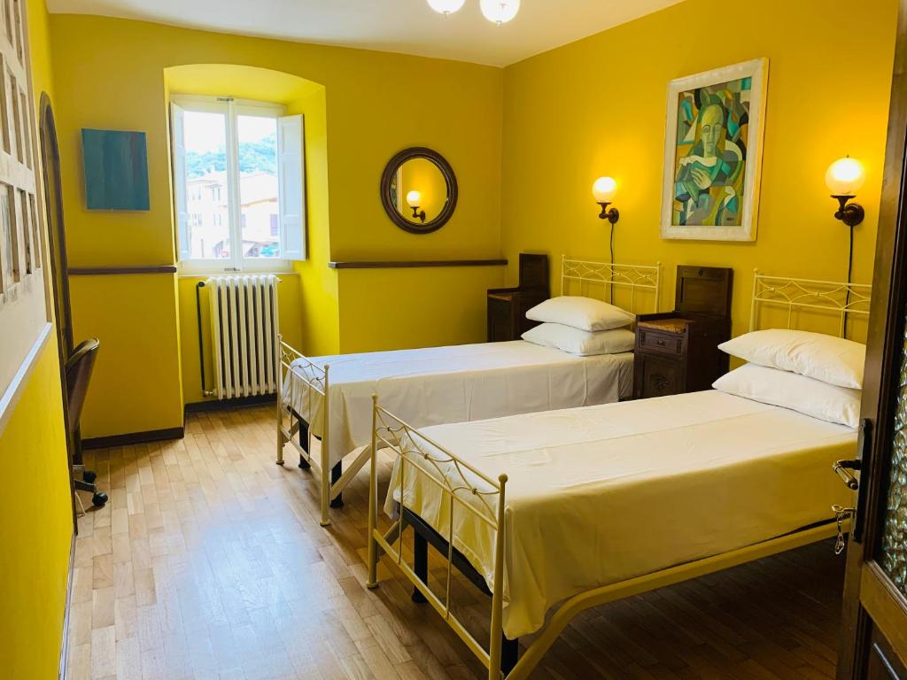 Posteľ alebo postele v izbe v ubytovaní Casa Robina