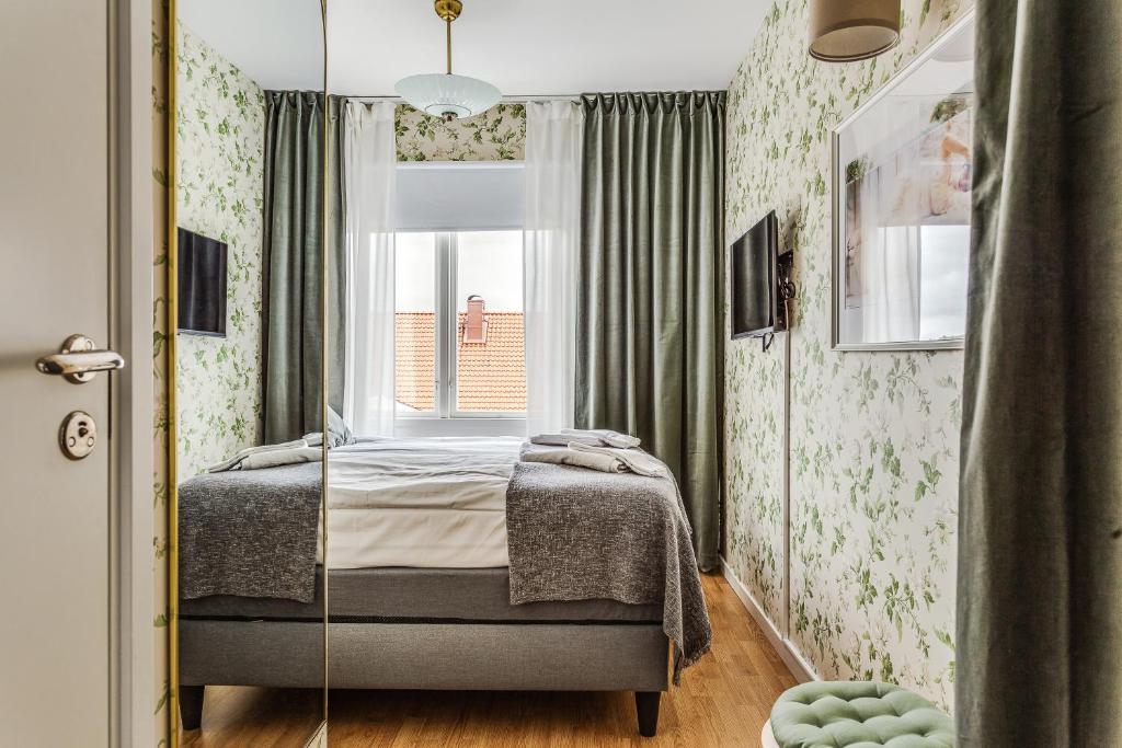 Postel nebo postele na pokoji v ubytování Hotell Nordevik