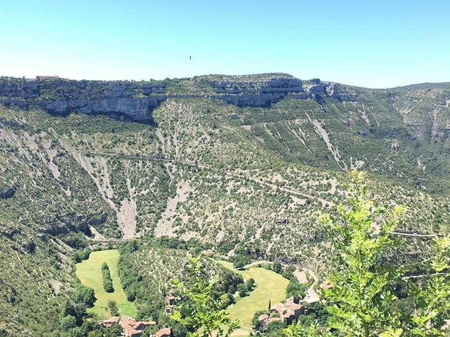 an aerial view of a golf course in a mountain at Cabane et potager sud Cévennes, jacuzzi en option in Roquedur