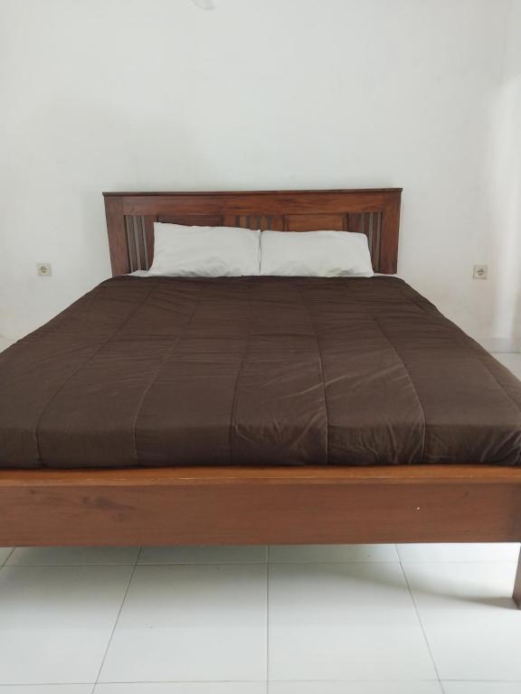 Postel nebo postele na pokoji v ubytování Lombok Collection Gili Air