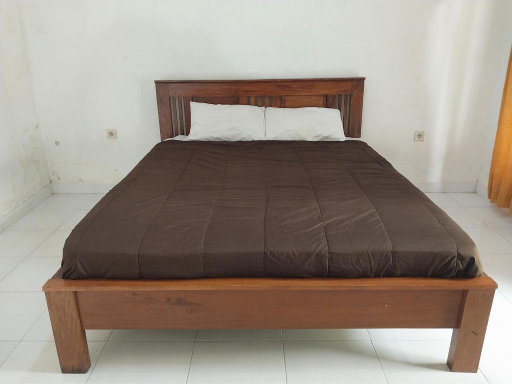 Postel nebo postele na pokoji v ubytování Lombok Collection Gili Air