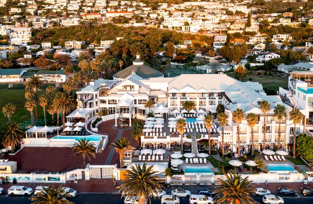 an aerial view of a resort with palm trees at The Bay Hotel in Cape Town