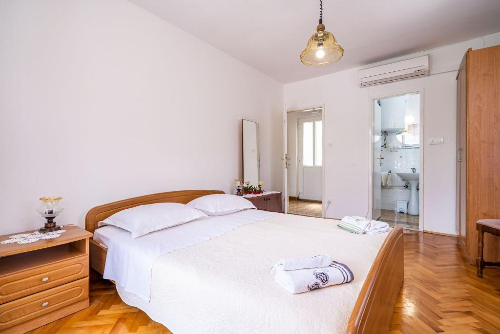 Posteľ alebo postele v izbe v ubytovaní Apartments Zarac