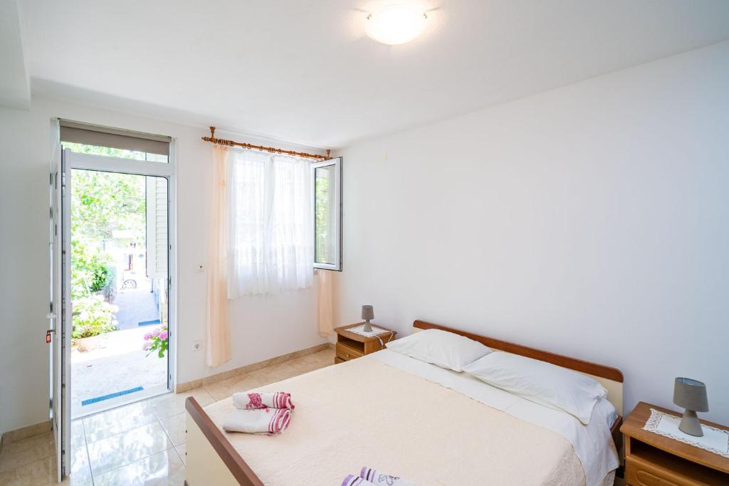 Posteľ alebo postele v izbe v ubytovaní Apartments Zarac
