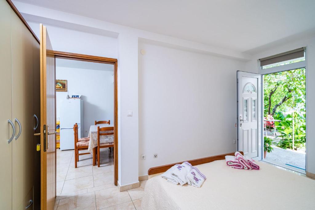 Posteľ alebo postele v izbe v ubytovaní Apartments Zarac