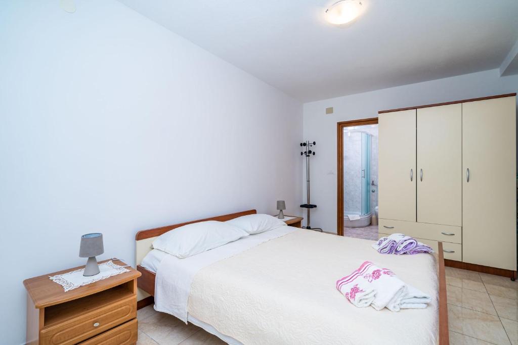 Posteľ alebo postele v izbe v ubytovaní Apartments Zarac