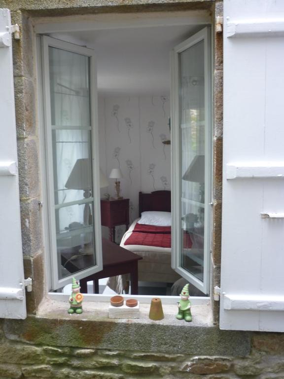Łóżko lub łóżka w pokoju w obiekcie La Maison de Claire