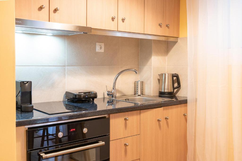 Kuchyňa alebo kuchynka v ubytovaní Acropolis Sweet House 3