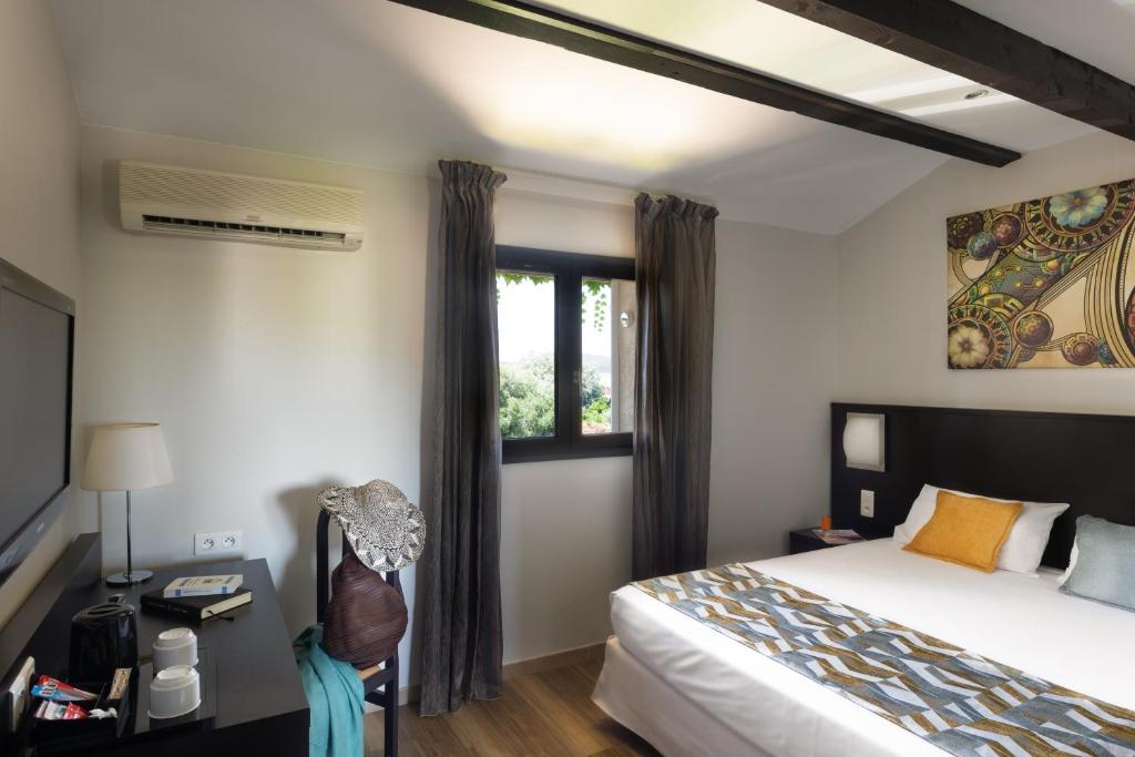 Postel nebo postele na pokoji v ubytování Hotel U Ricordu & Spa