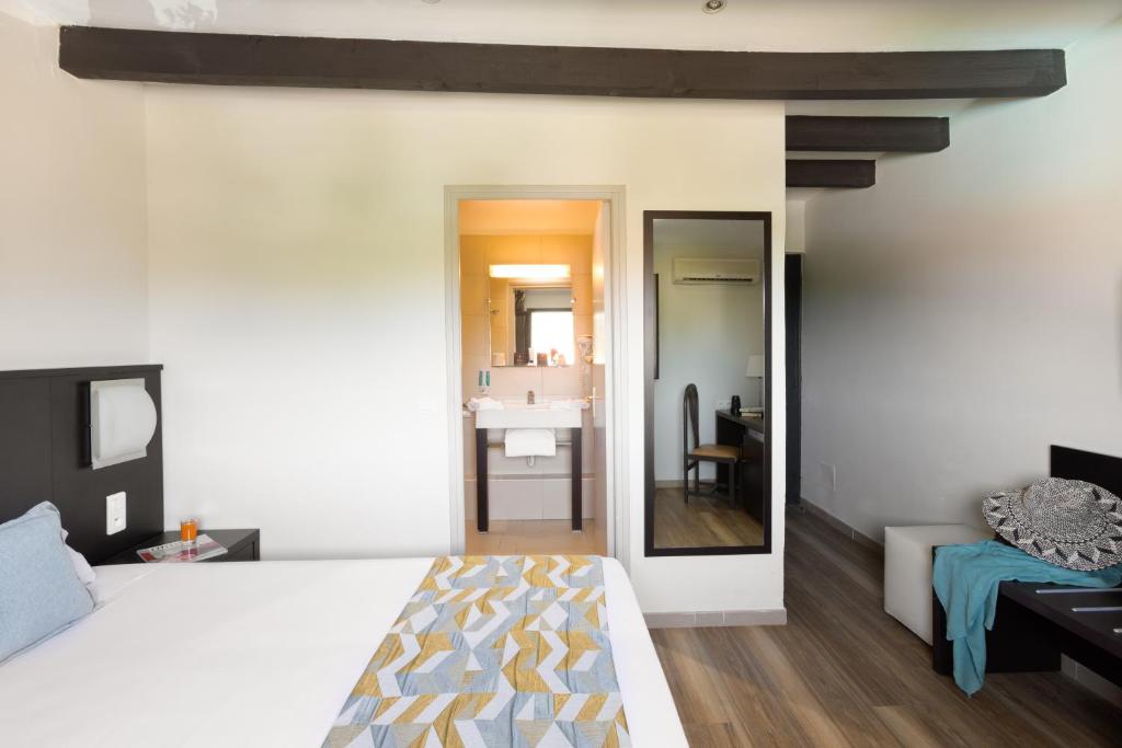 Postel nebo postele na pokoji v ubytování Hotel U Ricordu & Spa