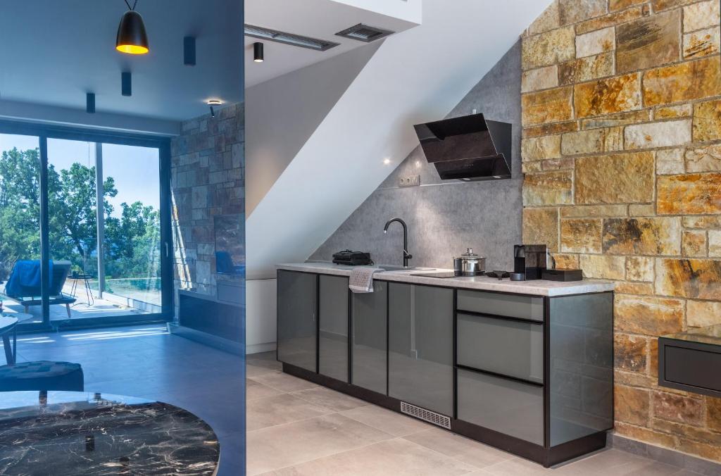 A kitchen or kitchenette at Ilvy Suites Sivota
