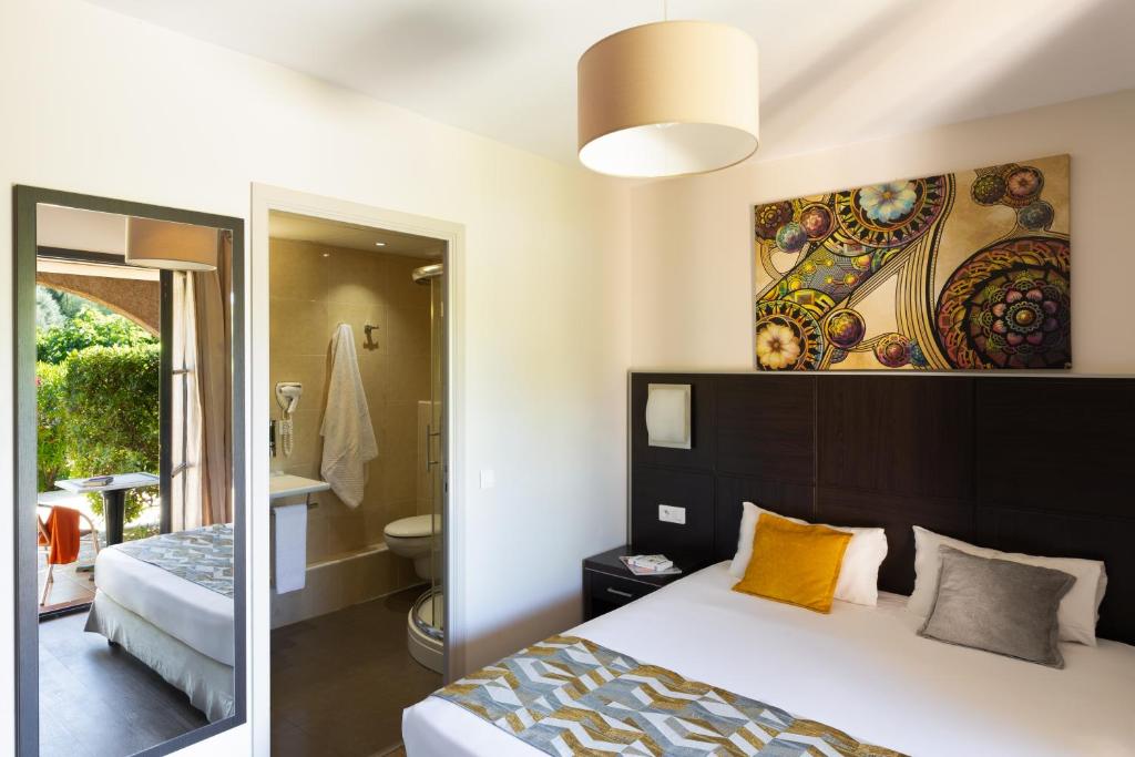 Postel nebo postele na pokoji v ubytování Hotel U Ricordu & Spa