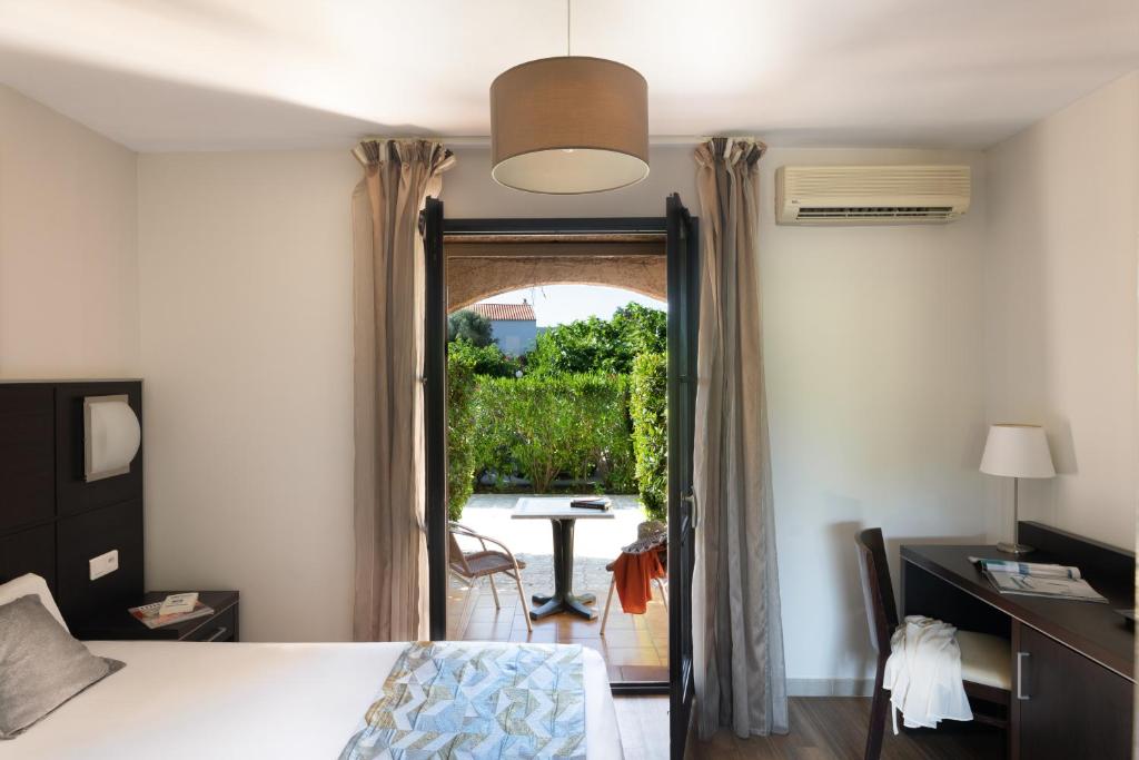 Postel nebo postele na pokoji v ubytování Hotel U Ricordu & Spa